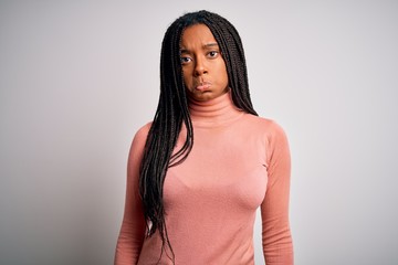Obraz premium Young african american woman standing casual and cool over white isolated background depressed and worry for distress, crying angry and afraid. Sad expression.