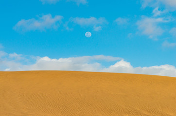 Maspalomas dune and the moon in the sky