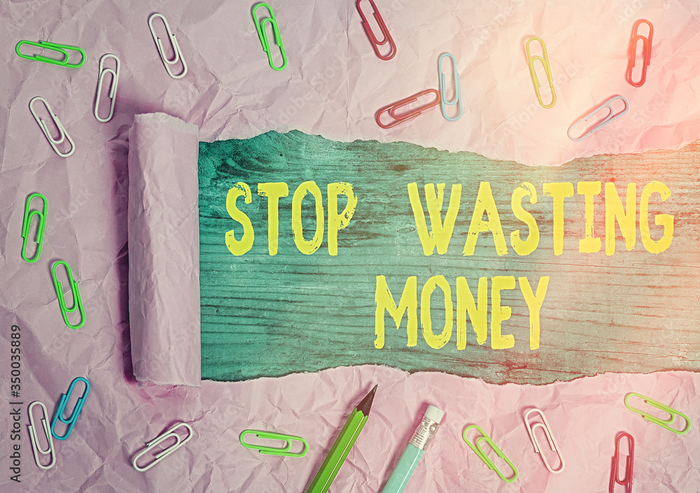Aufkleber writing note showing stop wasting money. business concept for advicing an individual or group to sta