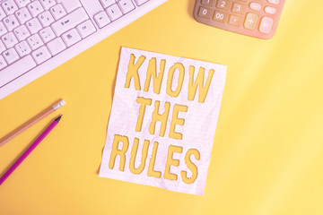 Writing note showing Know The Rules. Business concept for set explicit or regulation principles...