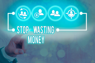 Writing note showing Stop Wasting Money. Business concept for advicing an individual or group to...