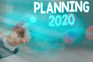 Conceptual hand writing showing Planning 2020. Concept meaning process of making plans for...