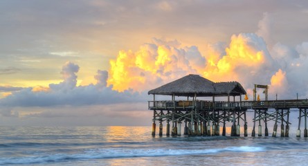 Sunrise by the pier at Cocoa Beach, Florida