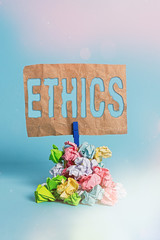 Writing note showing Ethics. Business concept for the moral philosophy or code of morals practiced...