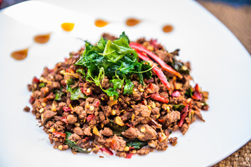 Thai Food Rice topped with egg and stir-fried beef and basil, famous street food in Thailand, fast food, soft focus