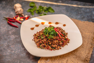 Thai Food Rice topped with egg and stir-fried beef and basil, famous street food in Thailand, fast food, soft focus