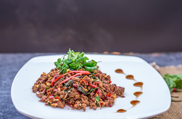 Thai Food Rice topped with egg and stir-fried beef and basil, famous street food in Thailand, fast food, soft focus