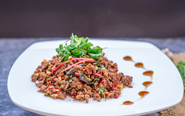 Thai Food Rice topped with egg and stir-fried beef and basil, famous street food in Thailand, fast food, soft focus