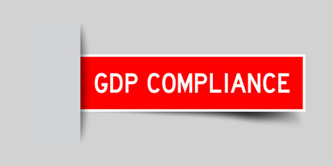 Inserted red color sticker label with word GDP (Abbreviation good distribution practice) Compliance on gray background