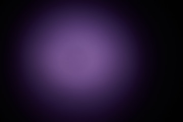 Blurred volumetric oval cloud of purple light against a dark background