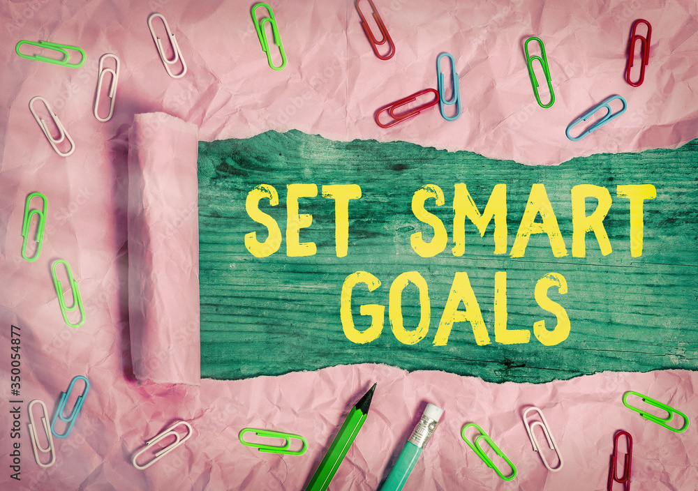 Poster writing note showing set smart goals. business concept for list to clarify your ideas focus efforts 