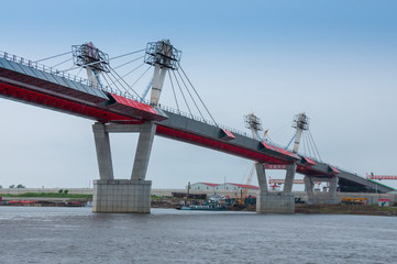 Fototapeta na wymiar Russia, Blagoveshchensk, July 2019: Bridge on the Amur river from Blagoveshchensk to the Chinese city of Heihe in summer