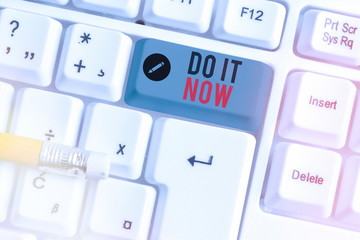 Conceptual hand writing showing Do It Now. Concept meaning not hesitate and start working or doing...