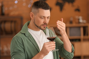 Man tasting wine at the restaurant