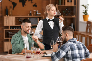 People tasting wine at the restaurant