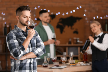 Man tasting wine at the restaurant