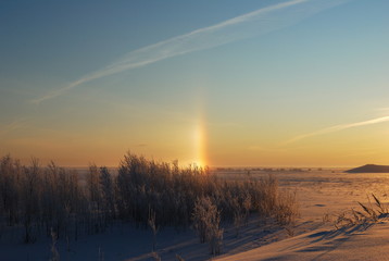 Sunny halo on a frosty December morning. Khanty-Mansiysk. Western Siberia. Russia.