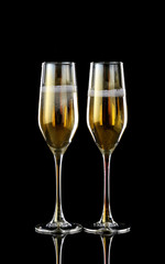 Glasses of champagne on dark background