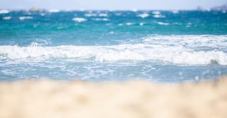 Fototapeta na wymiar close up on white sand and sea waves travel background