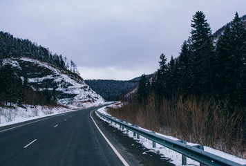 Snowfall on the road on the pass