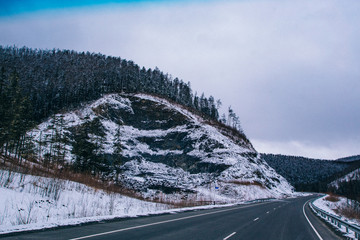 Snowfall on the road on the pass