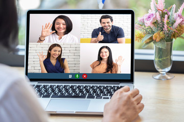 Fototapeta na wymiar Back view of woman talking to video chat with colleagues using laptop webcam in video conference , Business team smart working online meeting in video call from home