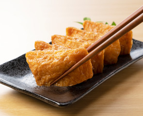 Inari Sushi set against a wooden background