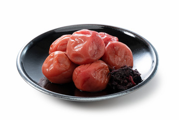 Japanese pickled plums on a white background