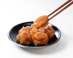 Japanese pickled plums on a white background