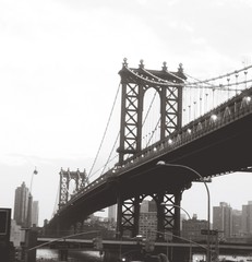 Manhattan Bridge By Building Against Sky