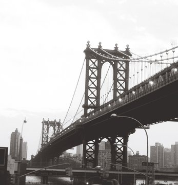Manhattan Bridge By Building Against Sky © chiara callari/EyeEm