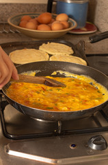 Home made arepas and eggs with onion and tomatoes. Typical colombian food criollo eggs