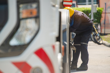 The filling hose is connected to the tank truck,Fueling Up a Freight Transport Truck.