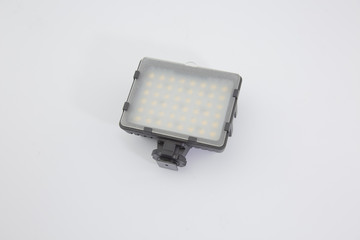 LED light on the camcorder is placed on a white background.