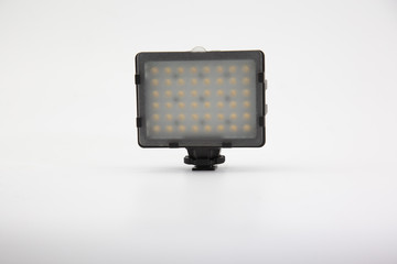 LED light on the camcorder is placed on a white background.