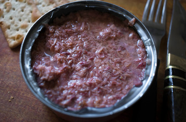 can of crumbled tuna with water biscuits