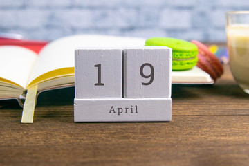 April 19 on the wooden calendar.The nineteenth day of the spring month, a calendar for the workplace. Spring