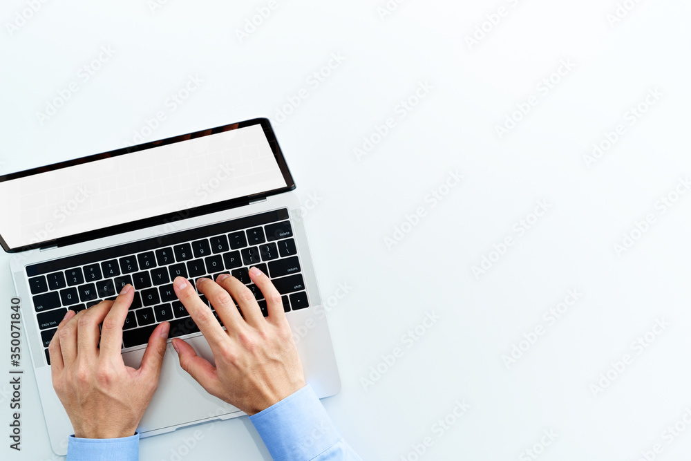Aufkleber Top view of laptop with blank display. Businessman using laptop on white background.