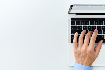 Top view of laptop with blank display. Close up of businessman using laptop on white background.