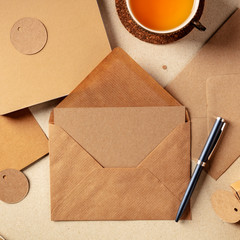 An assortment of brown kraft papers, with an envelope, a greeting card, a notebook, a label,...