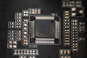 Computer components. PCB to PC. Chip, capacitor and connectors on the motherboard of a personal computer. Close up  circuit board of an electronic device. Modern technological background.