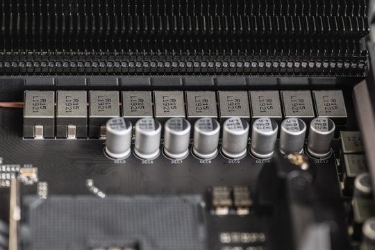 Computer components. Close up VRM zone on modern motherboard, capacitors.  Close-up of the power phase of a personal computer. Socket am4