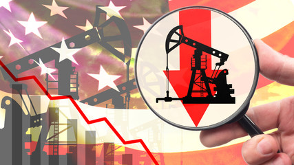 Crude oil cost reduction. Shale oil from the USA. Concept - fall of USO index. Silhouette of an oil pump. Magnifying glass as a symbol of analysis. Graph on the background of flag of America.