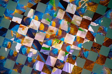 Multi-color geometric pattern. Geometric background of several levels. The image is divided into squares, rectangles, and circles.
