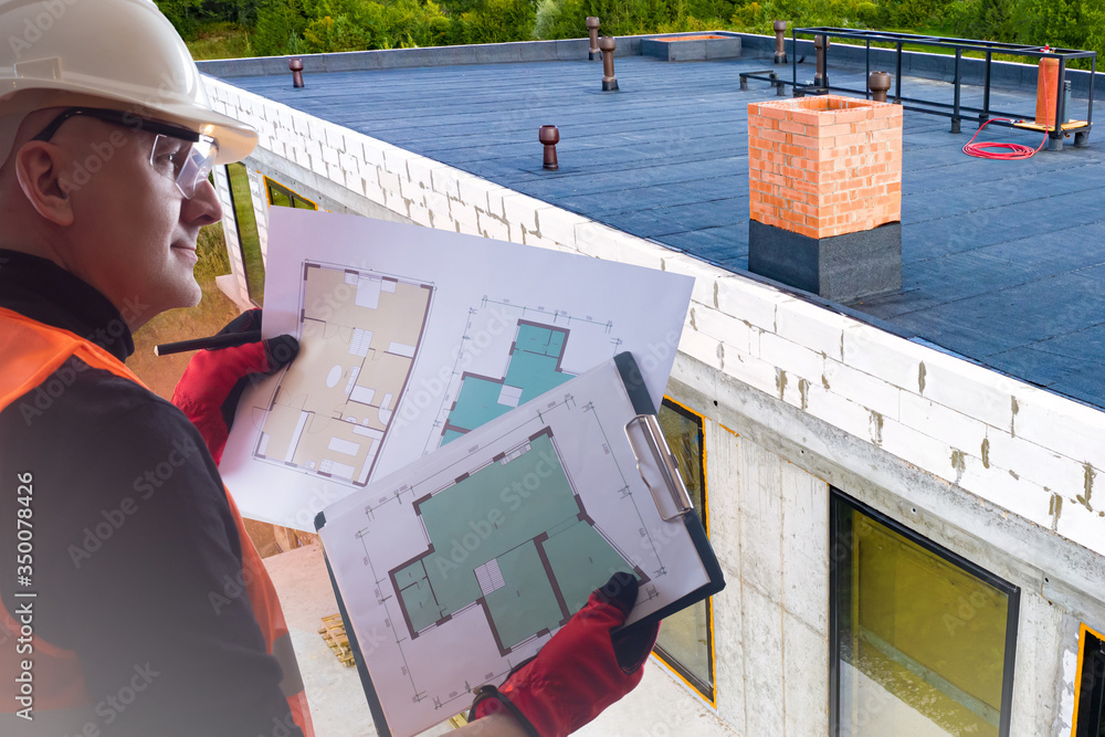 Poster construction engineer. developer with construction documentation on the background of a building und