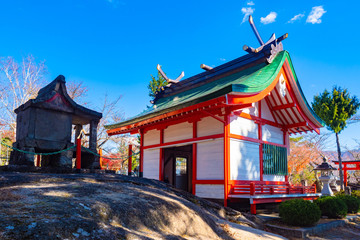 Obraz premium Japan. Yamanashi Prefecture. Canyon near the town of Kofu. Modern and ancient Shinto temples. Iconic buildings of Japan. Traditional Japanese architecture. Fragments of an ancient stone building.