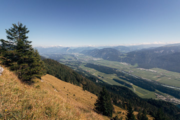 View over the Inntal valley from a hiking trail with the towns of Kundl and Worgl visible. Tyrol, Austria.