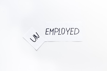 Unemployed - employed - torn paper sheet on white background top view. Hiring concept.