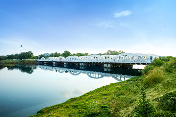 view of napier bridge arch shaped design reflection of bridge on Coovam river chennai tamil nadu...