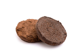 Ground coffee from coffee machine isolated on white background